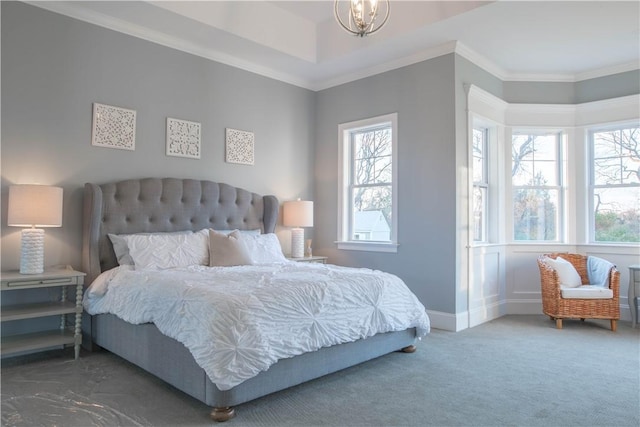 bedroom with dark colored carpet, ornamental molding, and a notable chandelier