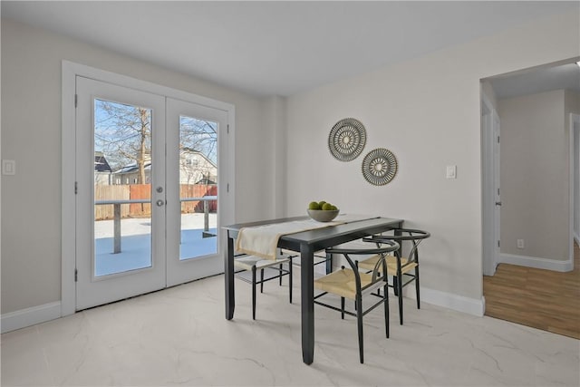 dining space with a healthy amount of sunlight and french doors