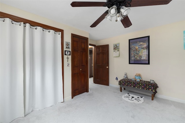 sitting room featuring light colored carpet