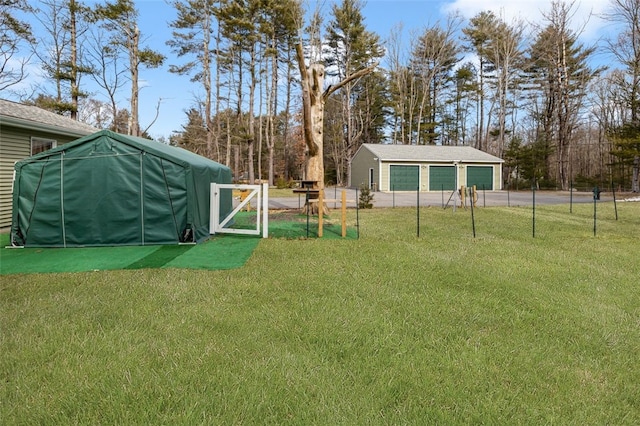 view of yard with an outbuilding and a garage