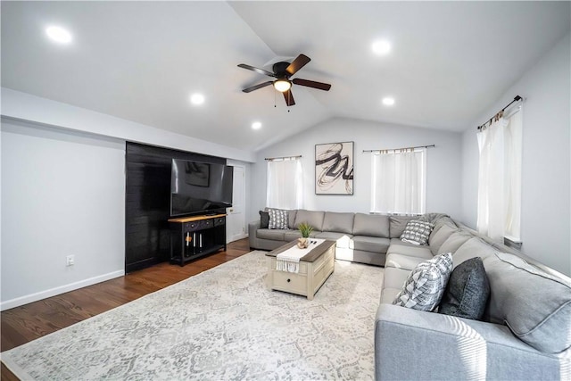 living room with lofted ceiling, wood-type flooring, and ceiling fan