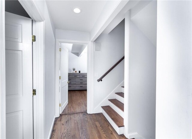 hall with dark hardwood / wood-style flooring