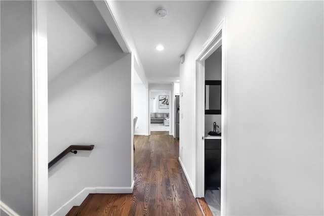 hallway featuring dark wood-type flooring