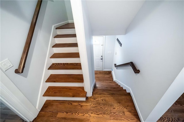 staircase featuring hardwood / wood-style flooring