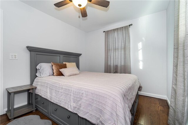 bedroom featuring dark hardwood / wood-style flooring and ceiling fan