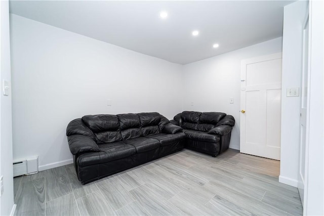 living room featuring light hardwood / wood-style flooring and baseboard heating