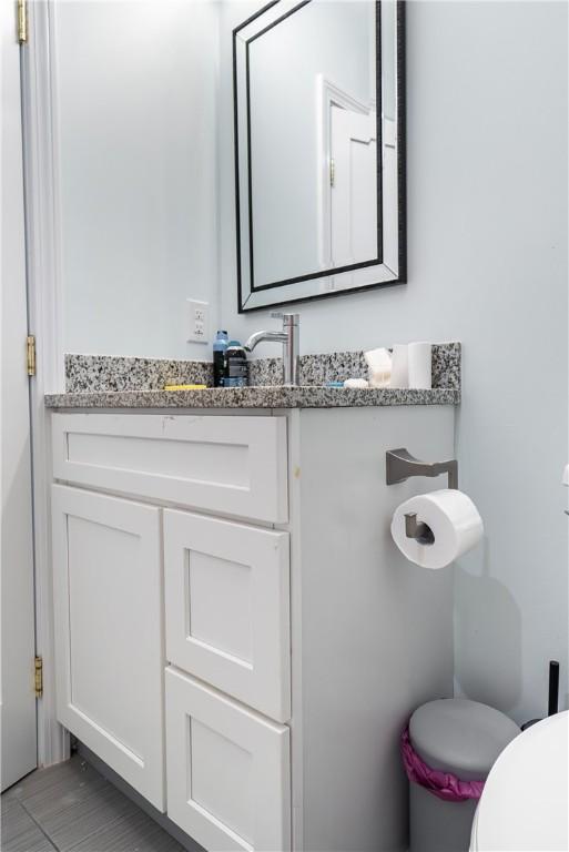 bathroom with vanity and toilet