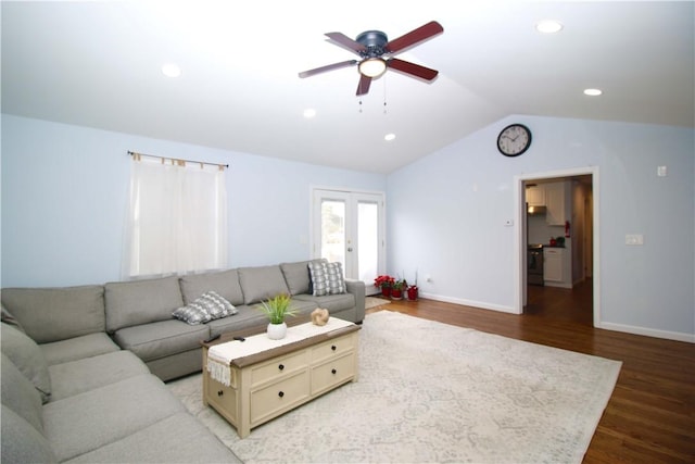 living room featuring hardwood / wood-style flooring, ceiling fan, lofted ceiling, and french doors