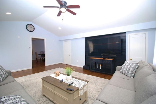 living room featuring ceiling fan, vaulted ceiling, and hardwood / wood-style floors