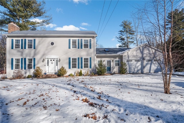 colonial home with a garage