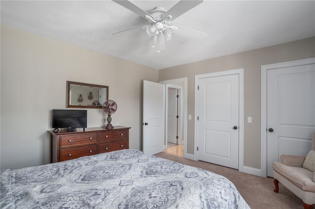 bedroom with light carpet and ceiling fan