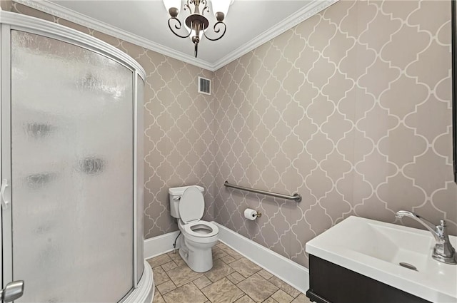 bathroom with ornamental molding, sink, walk in shower, and toilet