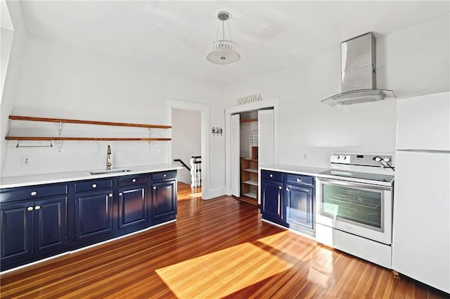 kitchen with white appliances, ventilation hood, decorative light fixtures, and blue cabinets