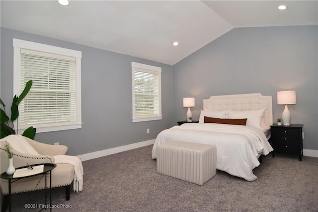 carpeted bedroom featuring lofted ceiling