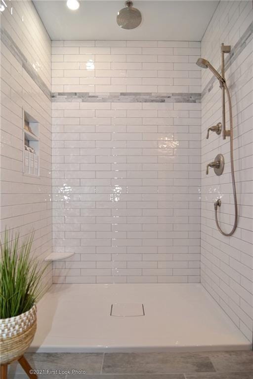 bathroom with a tile shower