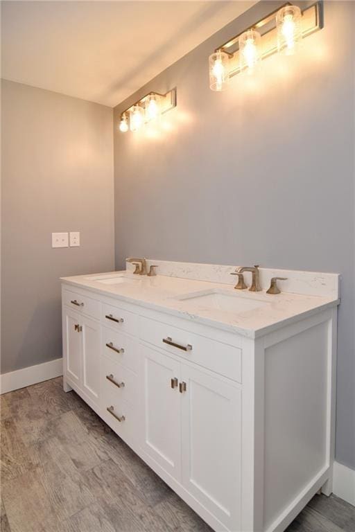 bathroom featuring hardwood / wood-style flooring and vanity