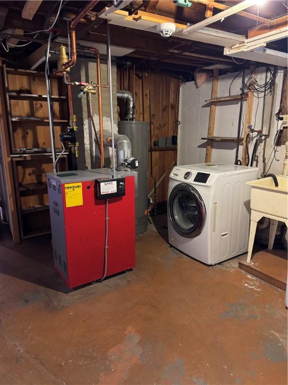 basement with washer / clothes dryer and gas water heater