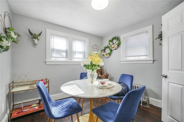 dining space featuring dark hardwood / wood-style floors