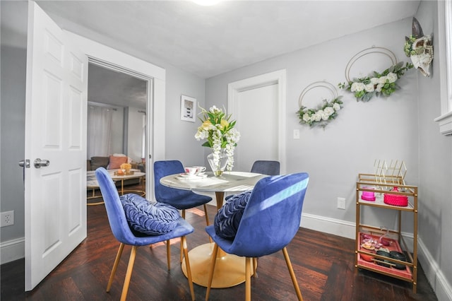 dining room featuring dark hardwood / wood-style flooring