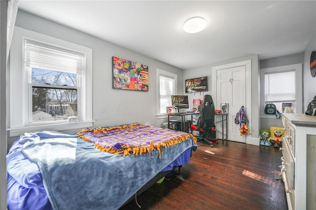 bedroom featuring dark hardwood / wood-style flooring