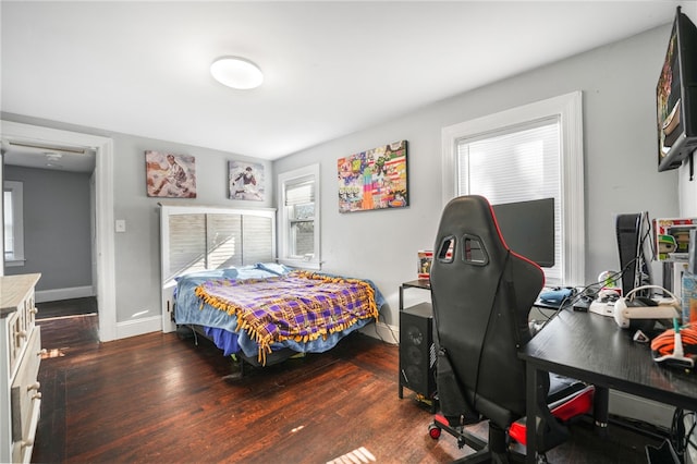 bedroom featuring dark wood-type flooring