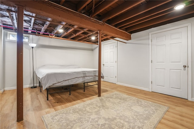 basement featuring hardwood / wood-style floors