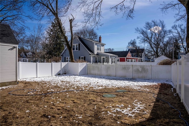 view of yard layered in snow