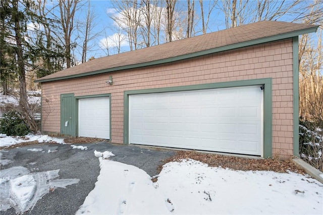 view of snow covered garage