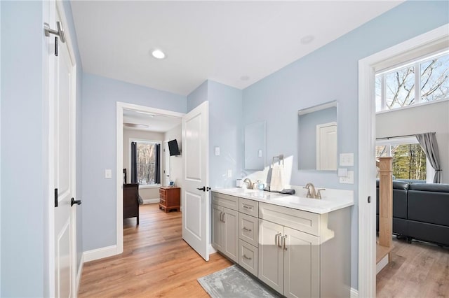 bathroom featuring vanity and hardwood / wood-style floors