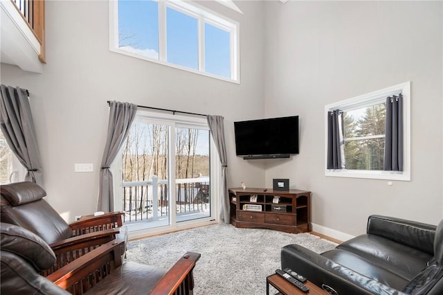 living room with a towering ceiling