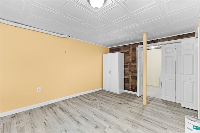 unfurnished bedroom featuring light hardwood / wood-style floors and a closet