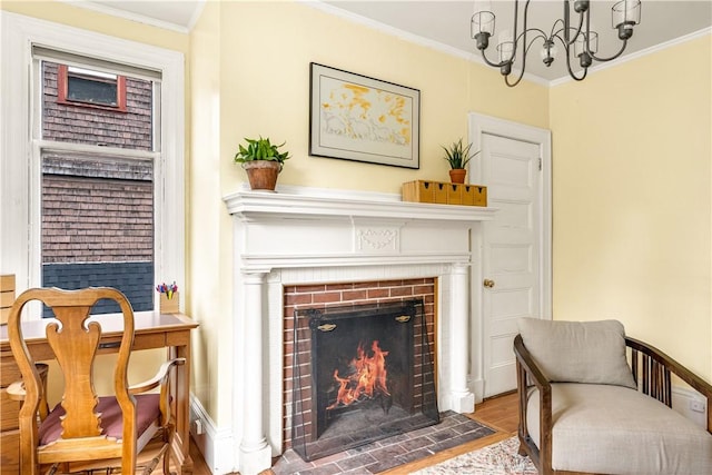 sitting room featuring a fireplace, wood-type flooring, and ornamental molding