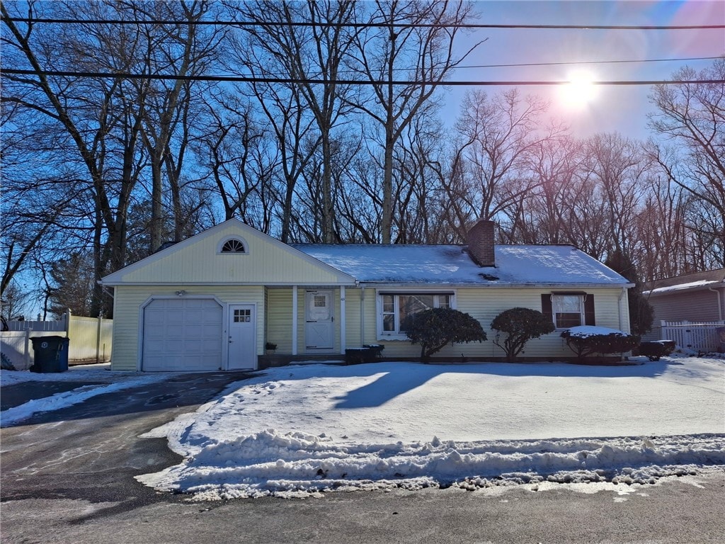 single story home featuring a garage