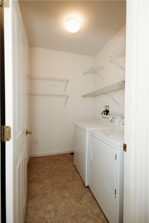 laundry room with washer and dryer