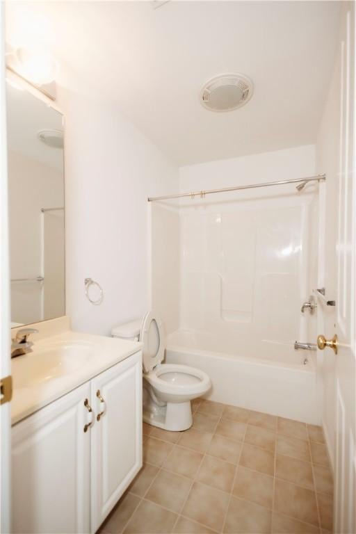 full bathroom featuring vanity, bathtub / shower combination, and toilet