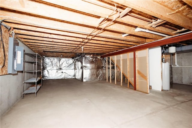 basement with gas water heater and electric panel