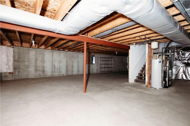 basement with water heater and electric panel