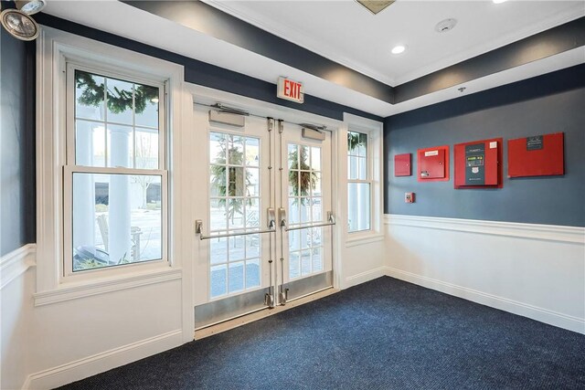 doorway to outside featuring baseboards, a wainscoted wall, dark carpet, recessed lighting, and french doors