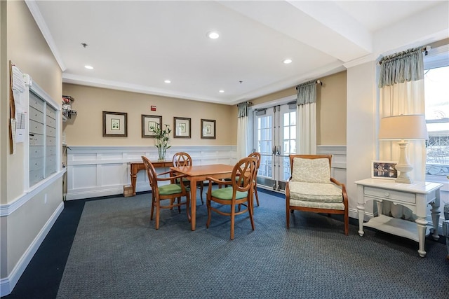 dining space featuring recessed lighting, french doors, a wainscoted wall, and crown molding