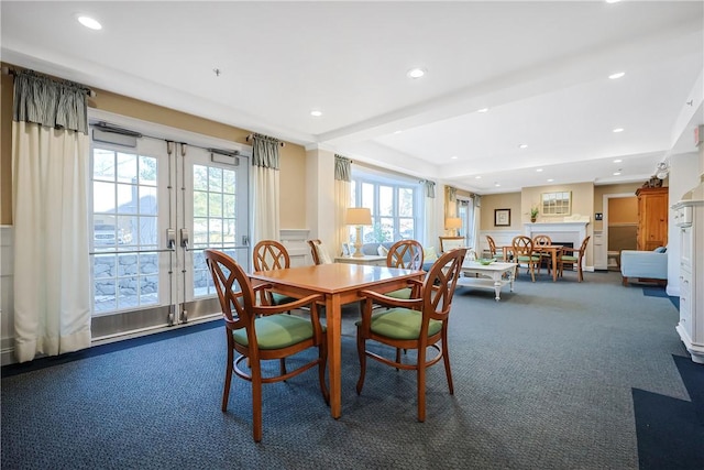 carpeted dining space featuring recessed lighting and french doors