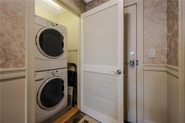 washroom featuring laundry area and stacked washer / drying machine