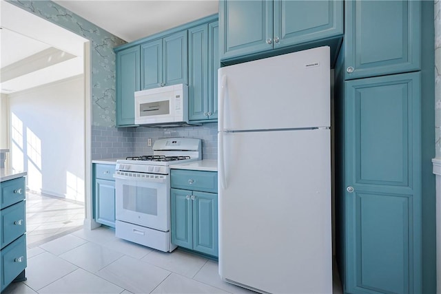 kitchen featuring tasteful backsplash, light countertops, light tile patterned flooring, white appliances, and blue cabinets