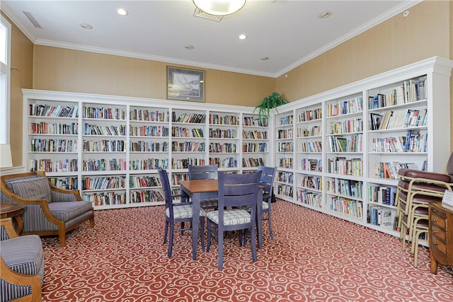 interior space featuring carpet flooring, crown molding, bookshelves, and visible vents