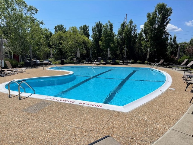 pool featuring a patio area