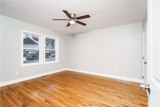 empty room featuring ceiling fan and light wood-type flooring