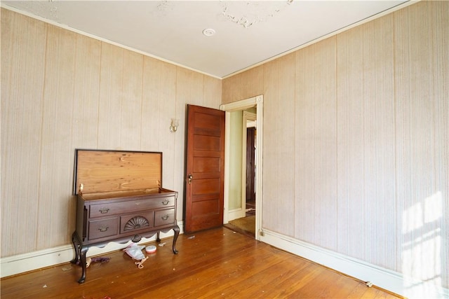 unfurnished room featuring hardwood / wood-style flooring