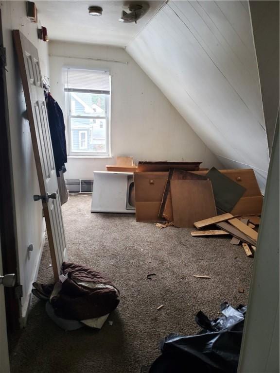 bonus room with lofted ceiling and carpet floors