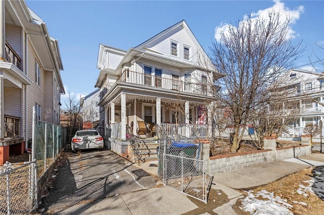 view of front of home featuring a balcony and a porch