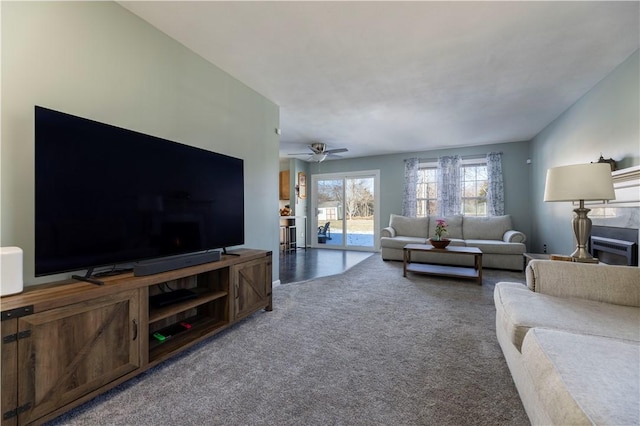 living room with carpet floors and ceiling fan