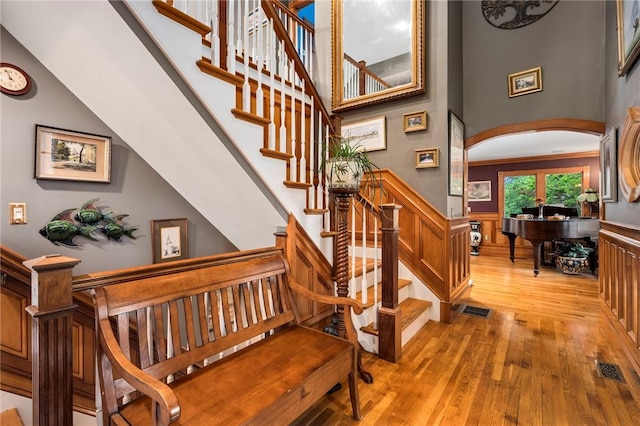 stairway with hardwood / wood-style floors